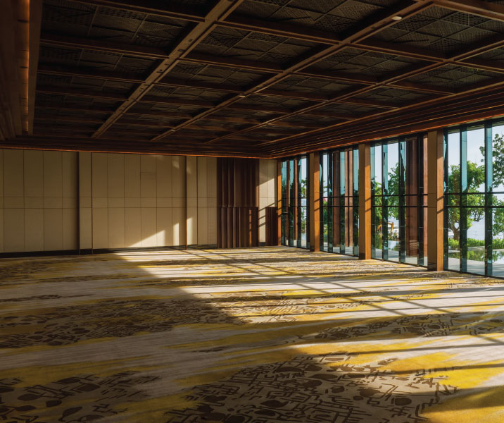 Ballroom interior with floor-to-ceiling glass facing the gardens