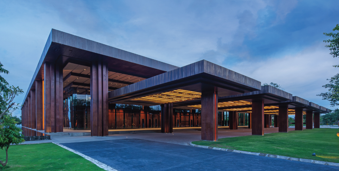 Colonnaded entrance of Bali Beach Convention Center at dusk
