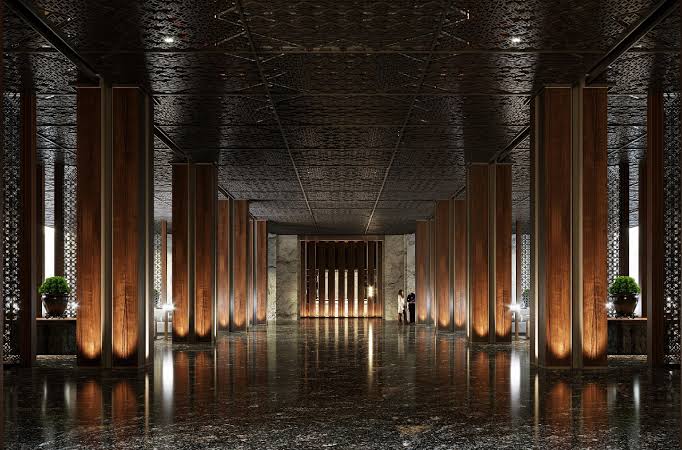 Interior lobby with timber columns and patterned ceiling